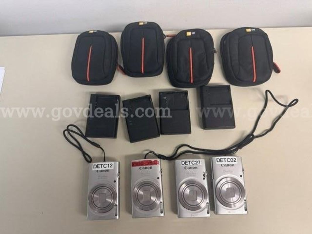 4 - Canon Cameras - Powershot 180 W/Cases And Chargers
