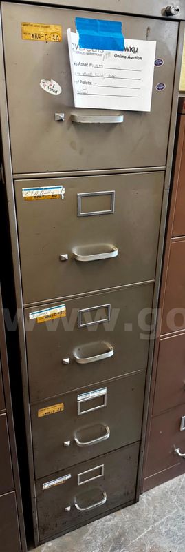 One Tan Vertical Filing Cabinet