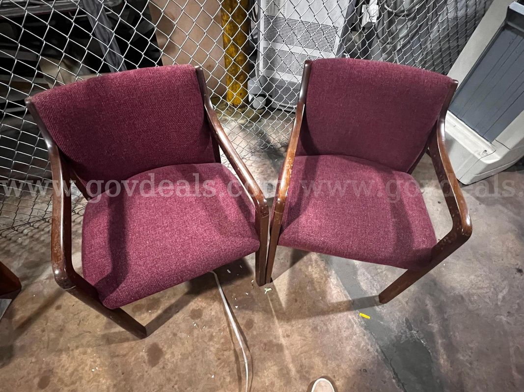 Lot of 2 Red cushioned chairs with wooden frame and arm rest