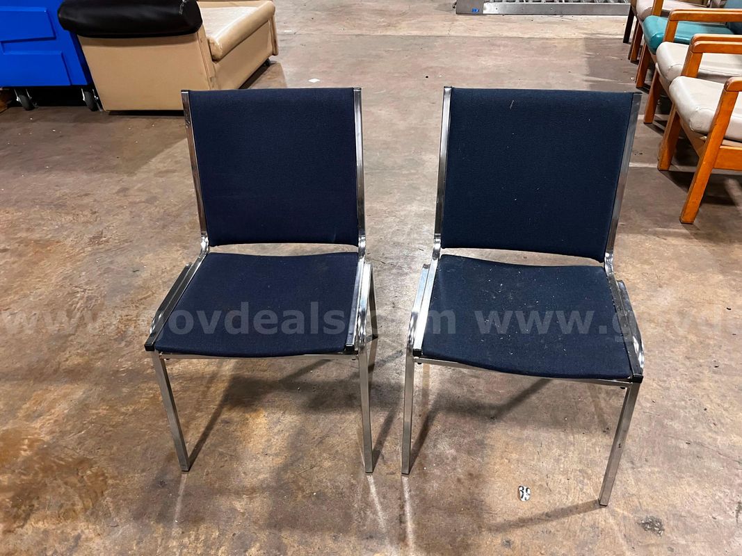 Lot two blue cushioned chairs with metal frame