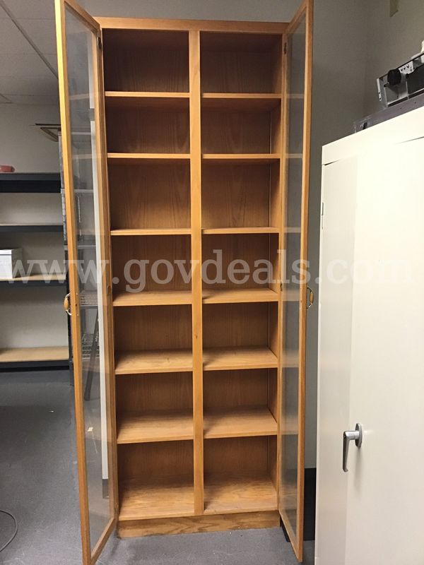 Tall storage/display cabinet with glass doors.