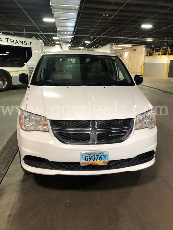 2019 White Dodge Caravan(Entervan), Wheelchair accessible with a manual pull out ramp. In Good condition.