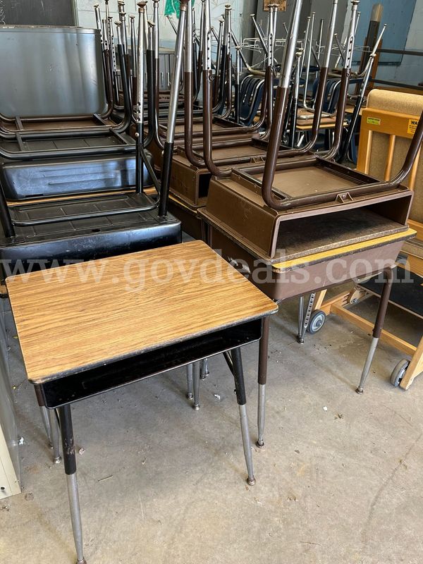 A Lot of 20 Student Desks Without Attached Chairs