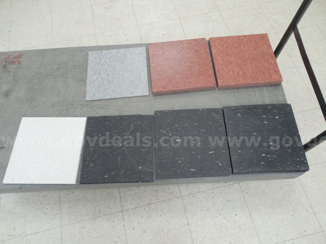 Collection of mixed composite vinyl tiles