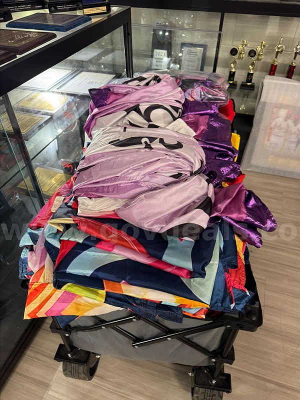 Assorted Color Guard Costumes, Flags, and Prop