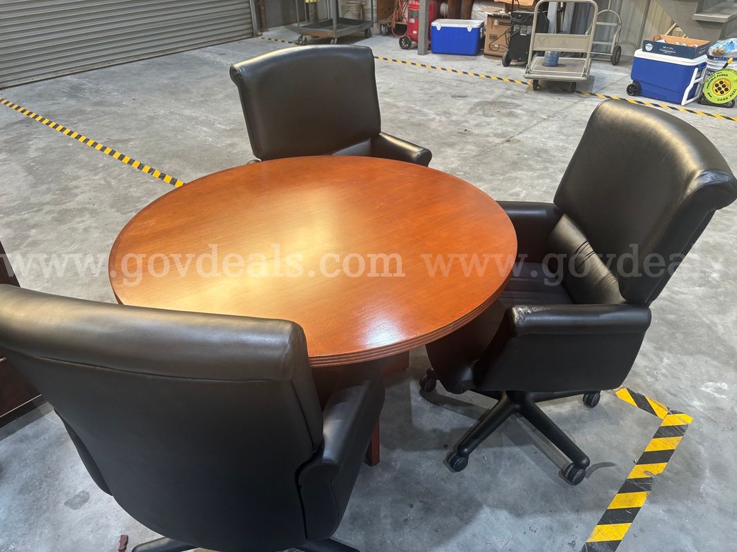 Round Cherry Office Table + Three Rolling Executive Chairs