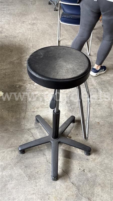 Black vinyl stool.