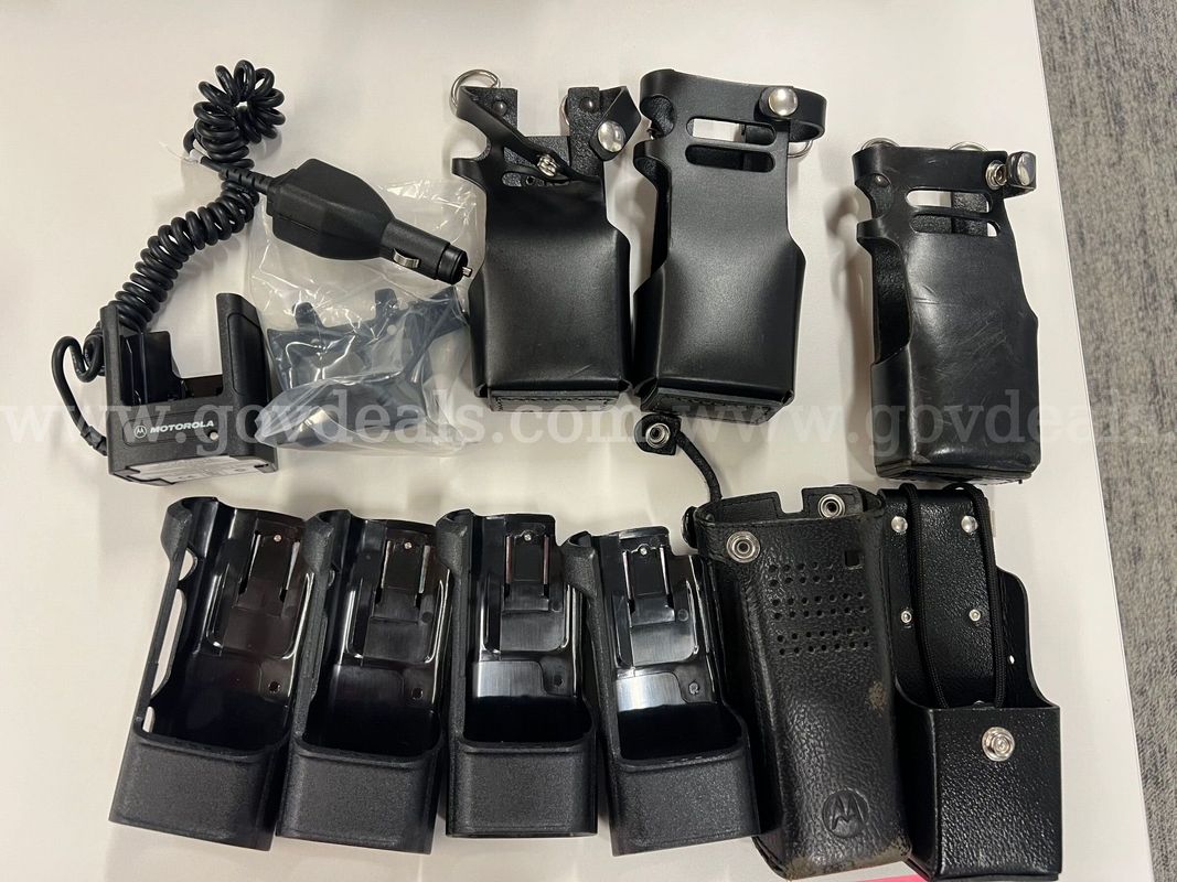 9 Motorola Radio Holsters & 1 Radio Charger