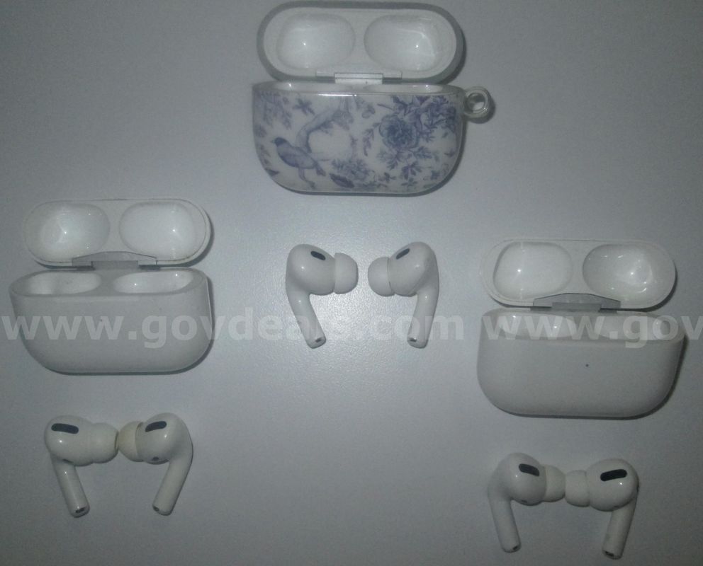 A lot of Apple Air Pods with charger and empty cases.